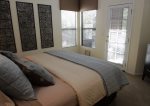 Master bedroom offers access to screened in patio